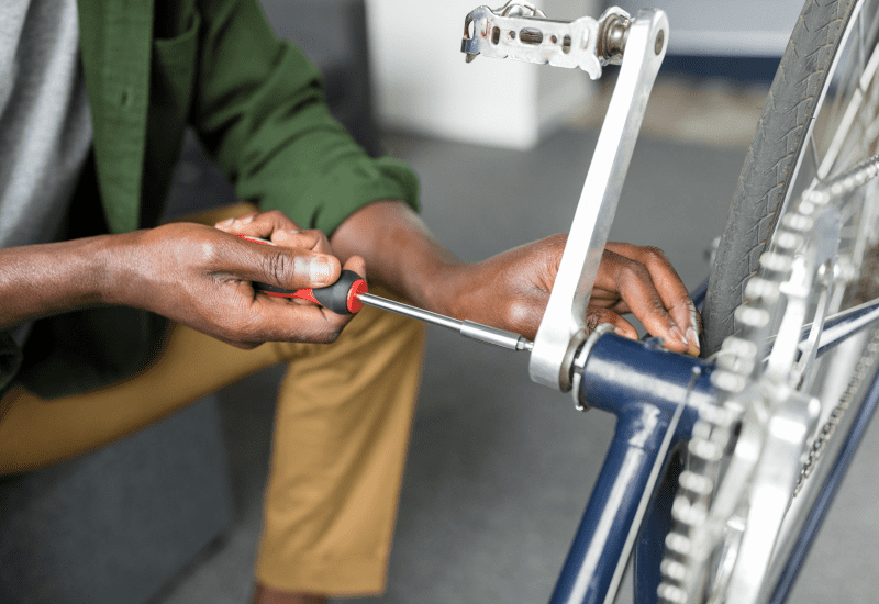 man assembling adult electric tricycle