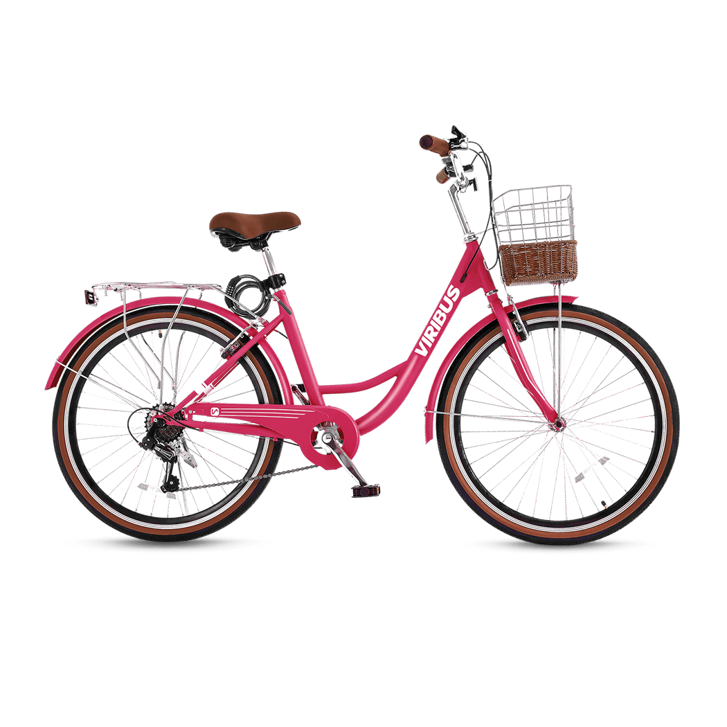 Pink bicycle with a basket on a black background